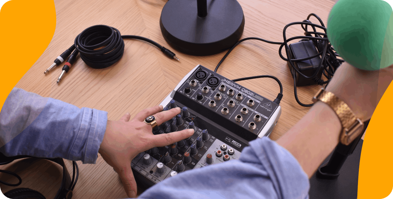 Radio station equipment: example of a quick set up with a mixing desk, microphone and headphones.