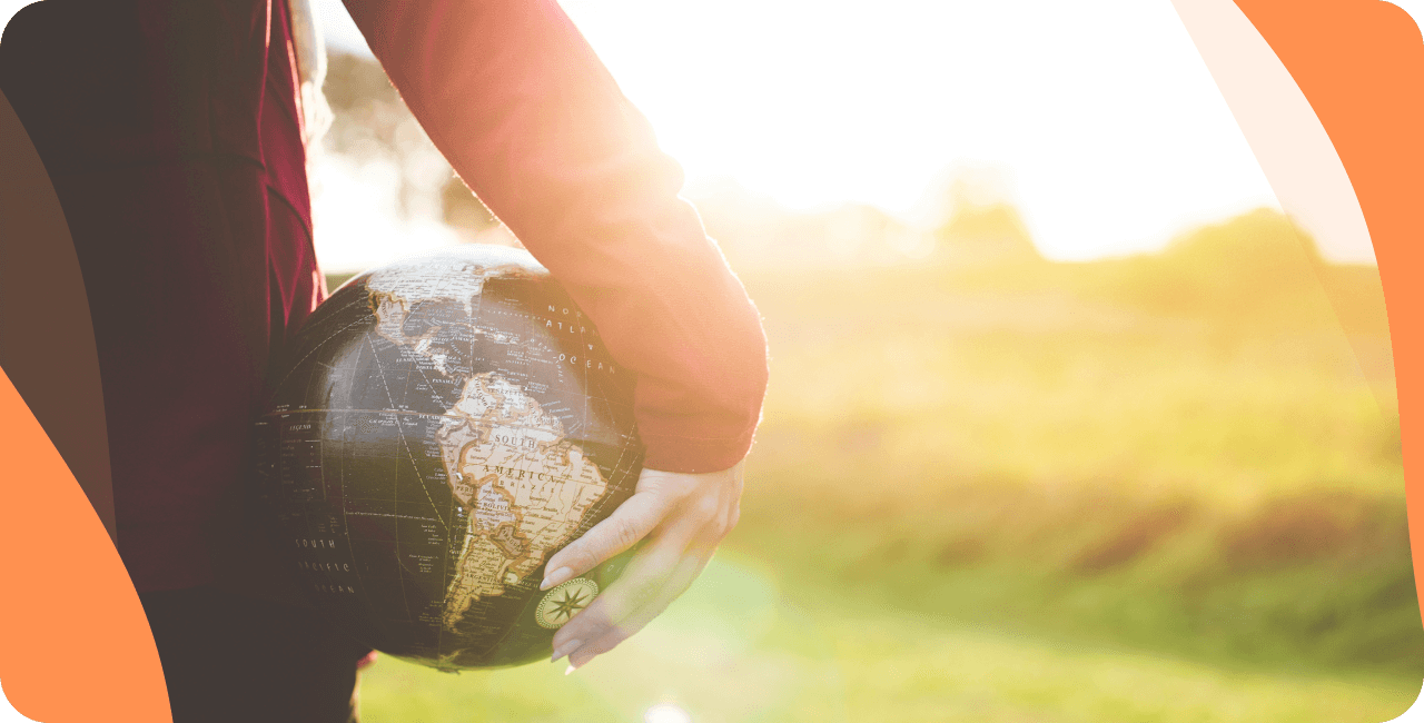 Person holding a globe